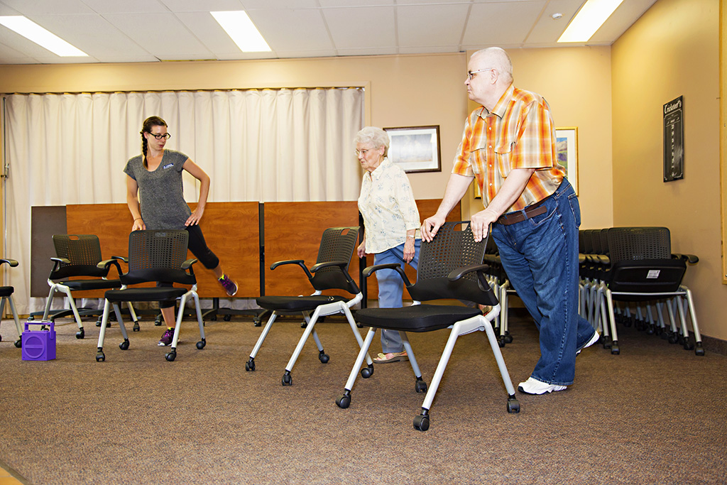 Instructor teaching chair excercise class 