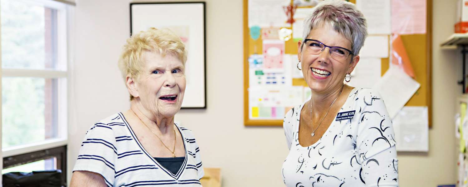 Support service Manager and Resident laughing together